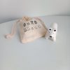 figurine ours blanc et son emballage pochon en coton